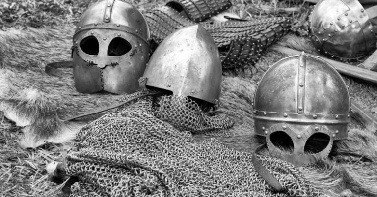 Protective Gear - Grayscale Photography of Chainmails and Helmets on Ground