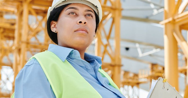 Visibility - Woman Wearing Helmet and Safety Vest