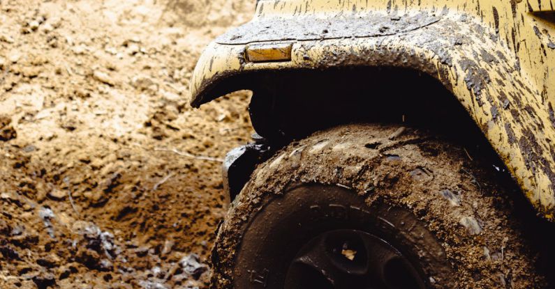 Extreme Conditions - Front of a Truck Covered in Mud